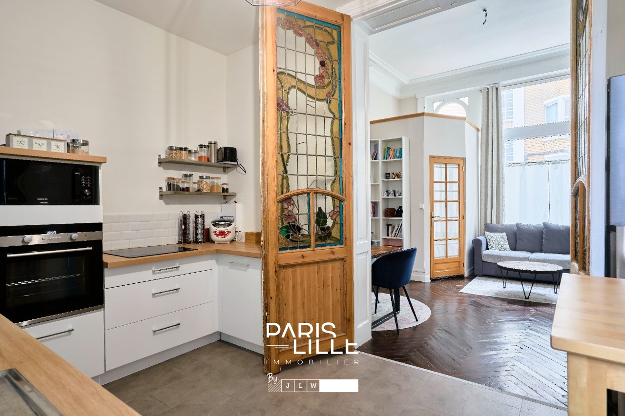 Appartement au cachet preserve Photo 1 - Paris Lille Immobilier